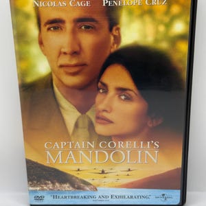 May include: DVD case for the movie "Captain Corelli's Mandolin" featuring Nicolas Cage and Penélope Cruz. The cover art includes the film's title and the tagline "Heartbreaking and Exhilarating."
