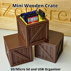 May include: Three brown mini wooden crates, one stacked on top of two others. The top crate holds SD cards and USB drives. Text on the image reads "Mini Wooden Crate" and "SD/Micro SD and USB Organizer."