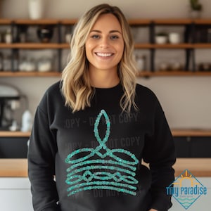 May include: A black sweatshirt with a teal blue design of a layered cake. The design has the text "Copy - Do Not Copy" repeated around it.