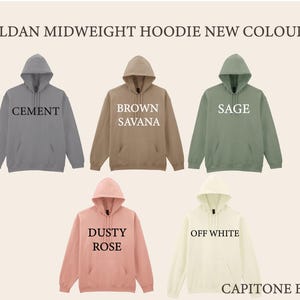 a collection of five hoodies in different colors, including gray, brown, green, white, and pink, arranged in a grid-like pattern.