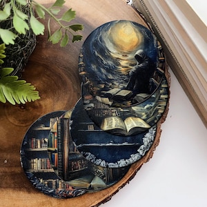 May include: Four round coasters with different designs. The first coaster features a dark blue and black sky with a bright yellow sun and a hooded figure standing in the distance. The second coaster features a dark blue and black sky with a bright yellow sun and a hooded figure standing in the distance. The third coaster features a dark blue and black sky with a bright yellow sun and a hooded figure standing in the distance. The fourth coaster features a dark blue and black sky with a bright yellow sun and a hooded figure standing in the distance.