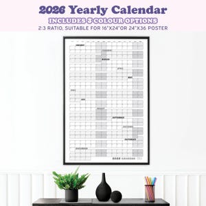 May include: A framed 2026 yearly calendar with a black border. The calendar includes the months of the year, with space for notes. The text at the top reads "2026 Yearly Calendar" and "Includes 3 Colour Options". The calendar is suitable for 16"x24" or 24"x36" posters.