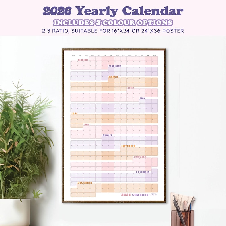 May include: A framed 2026 yearly calendar with a color-blocked design. The calendar includes three color options and is suitable for 16"x24" or 24"x36" posters. Months are labeled in a grid format. The text "2026 Yearly Calendar" is at the top.