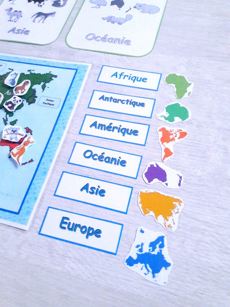 May include: A set of colorful continent maps with matching labels for a geography learning game. The continents are Africa, Antarctica, America, Oceania, Asia, and Europe.