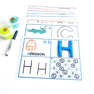 May include: A printable worksheet for learning the letter H. The worksheet features a picture of a hedgehog, the letter H written in uppercase and lowercase, and a larger letter H made with blue playdough. The worksheet also includes a section for tracing the letter H and a section for finding the letter H hidden among other letters.