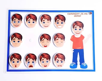 May include: A white board with a blue border and a blue and white dotted line around the edge. The board has the text "COMMENT JE ME SENS?" at the top. There are nine round images of a boy's face with different expressions. The boy's face is in the center of the board with his arms outstretched.