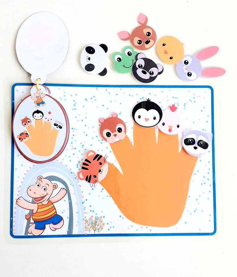 May include: A colorful felt finger puppet set with a variety of animal characters, including a panda, frog, penguin, chick, raccoon, squirrel, tiger, and bunny. The set includes a handprint template and a separate circle with a handprint and finger puppets.