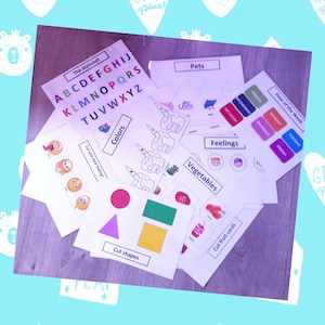 Peut inclure: Ensemble de cartes éducatives pour enfants, présentant l'alphabet, les couleurs, les formes, les jours de la semaine, les sentiments, les animaux de compagnie et les légumes. Les cartes sont imprimées sur papier blanc avec des illustrations et du texte colorés.