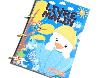 May include: A blue and yellow spiral bound book with the title "Livre Malin" and the text "J'apprends et je joue". The cover features a cartoon duck wearing a yellow hat and a blue umbrella, along with a monkey and a frog.