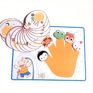 May include: A colorful finger puppet game with a variety of animals, including a tiger, a frog, a squirrel, a penguin, and a chicken. The game includes a hand-shaped board with a yellow background and blue trim.