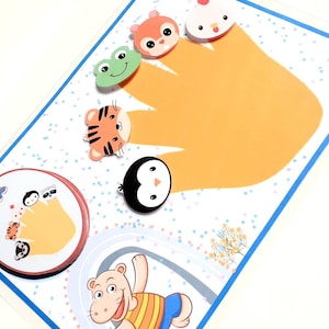 May include: A colorful felt hand puppet set with a variety of animal characters, including a squirrel, a chicken, a tiger, a penguin, and a frog. The puppets are designed to fit on fingers and are perfect for imaginative play.