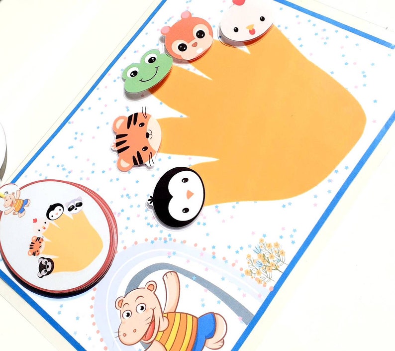 May include: A colorful felt hand puppet set with a variety of animal characters, including a squirrel, a chicken, a tiger, a penguin, and a frog. The puppets are designed to fit on fingers and are perfect for imaginative play.