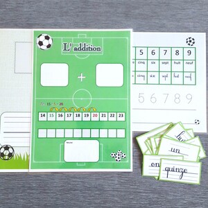 May include: A green and white worksheet with a football theme. The worksheet includes a maths addition problem, a number chart, and a section for writing numbers. The worksheet is titled "L'addition".
