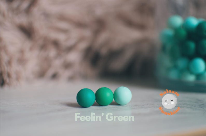 Three different shades of green 12mm silicone beads.