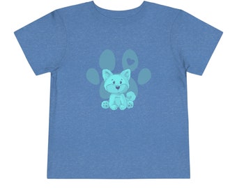 May include: A light blue t-shirt with a light blue puppy sitting inside a paw print with a small heart on top.