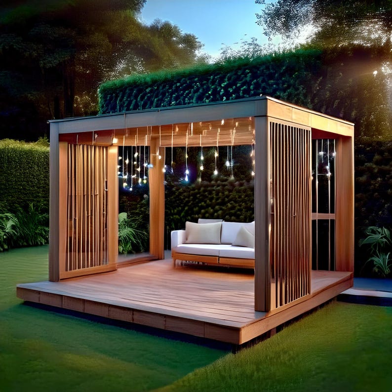 May include: A wooden gazebo with a light-colored sofa and decorative string lights. The structure has a slatted design on the sides and is set on a wooden deck. The background features lush greenery and a well-manicured lawn.