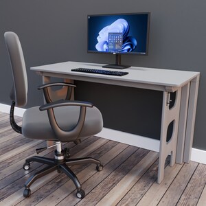May include: A gray office desk with a black computer monitor, keyboard, and a gray office chair. The desk has a white surface and a gray metal frame.