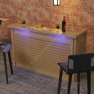 May include: A wooden bar counter with a light wood finish and a dark brown countertop. The bar counter has a built-in shelf and is illuminated with blue LED lights. Two black bar stools with gray seats are positioned in front of the counter. A grill with sausages is visible in the background.