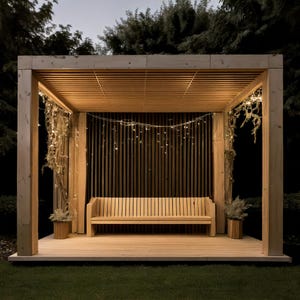 May include: A wooden pergola with a slatted roof and vertical back panel. A wooden bench sits inside the structure, with small potted plants on either side. String lights are draped across the top and sides, creating a warm, inviting atmosphere.