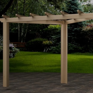 May include: A wooden pergola with a light brown finish stands in a garden setting. The structure has four vertical posts supporting a horizontal beam roof. The background features green grass, trees, and a glimpse of a wooden swing.