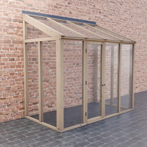 May include: A wooden framed glass greenhouse with a sloped roof and a door. The greenhouse is attached to a brick wall.