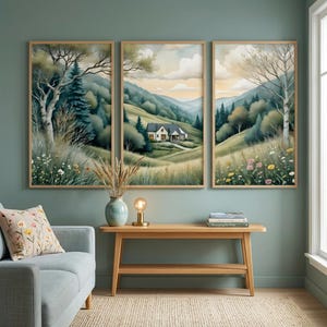 May include: Three framed landscape paintings depicting a serene countryside scene with a house nestled in rolling hills. The artwork features a palette of greens, blues, and yellows, with trees and wildflowers. The frames are a light wood color.