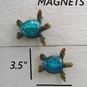 A collection of vibrant blue sea turtle magnets, each featuring a detailed and charming design. The magnets showcase cartoon-style turtles with vivid blue shells, adding a whimsical touch to your magnetic surfaces