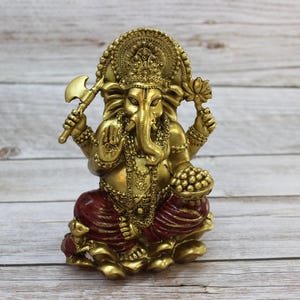 Bring wisdom, success, and positivity into your space with this Handcrafted Ganesha God Figurine!
