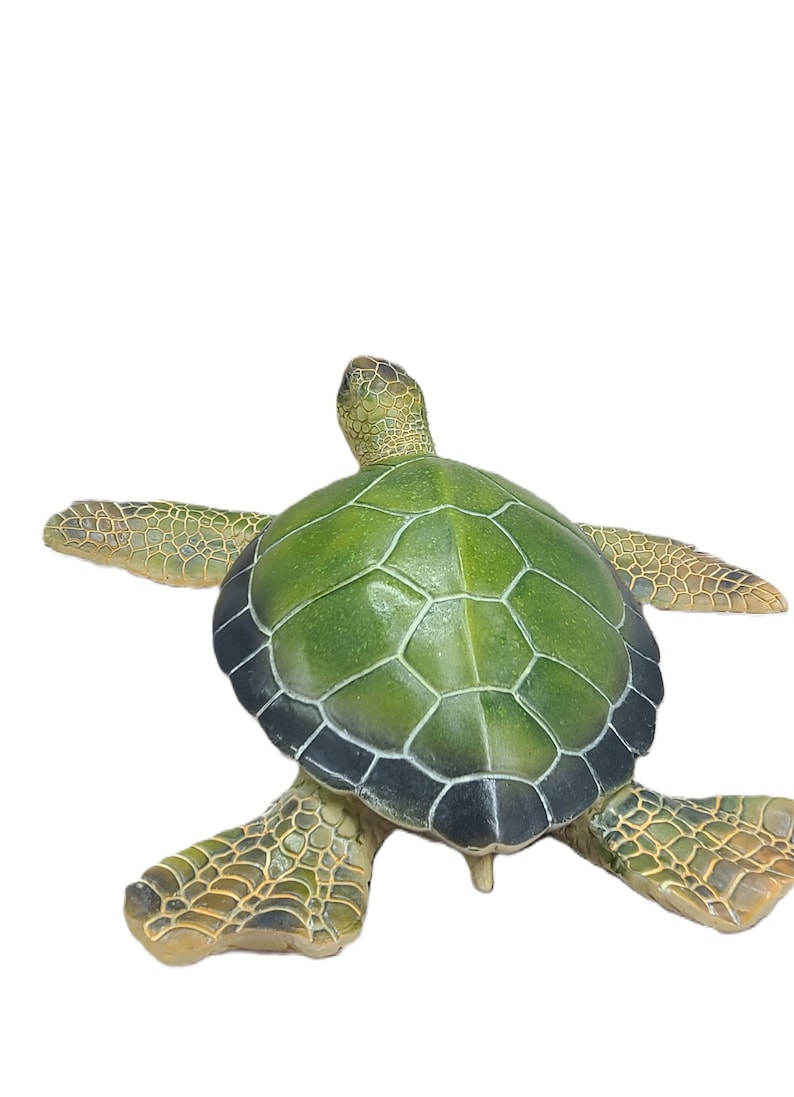 Majestic turtle figurine exuding a sense of grandeur and charm. The intricate details showcase the graceful curves and patterns on the shell, while the subdued yet rich color palette adds a touch of elegance