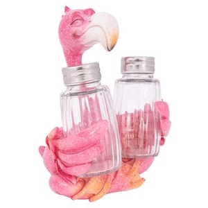 May include: Pink flamingo salt and pepper shaker set. The shakers are clear glass with a textured design. The flamingo is holding the shakers in its wings.