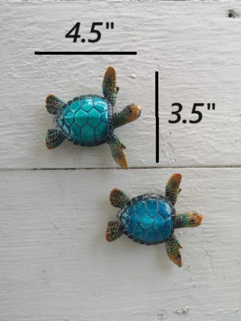 A charming figurine of a cartoon-style blue turtle, crafted with whimsical details. The turtle has a bright blue shell adorned with playful patterns, and its cute expression exudes a sense of friendliness