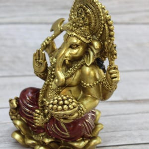 Bring wisdom, success, and positivity into your space with this Handcrafted Ganesha God Figurine!