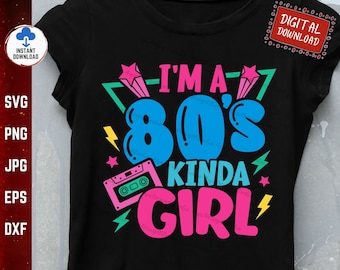 May include: A black t-shirt with a graphic design featuring a blue and pink 80's style font that says "I'm a 80's Kinda Girl". The graphic also includes a pink cassette tape, lightning bolts, and stars.
