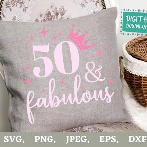 May include: A gray decorative pillow with the text "50 & fabulous" in pink, along with a pink crown and stars. The words "DIGITAL DOWNLOAD" are in a teal box. The pillow is on a chair.