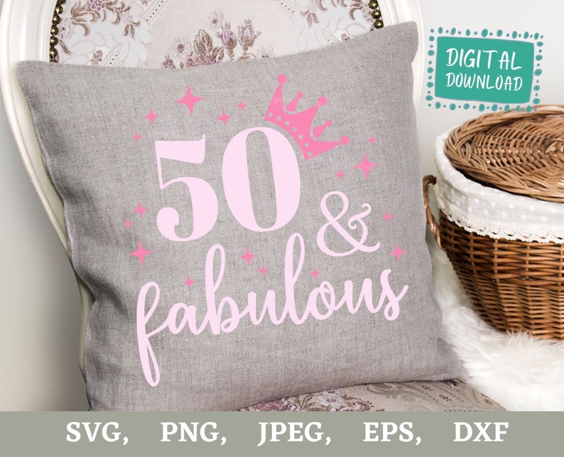 May include: A gray decorative pillow with the text "50 & fabulous" in pink, along with a pink crown and stars. The words "DIGITAL DOWNLOAD" are in a teal box. The pillow is on a chair.