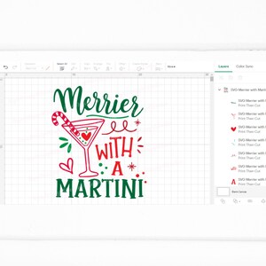 May include: Green and red text that reads "Merrier with a Martini" with a red martini glass with a candy cane and a red heart in the glass.