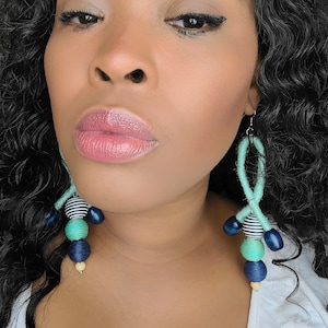 Nautica vibe rope and wood bead statement earrings.