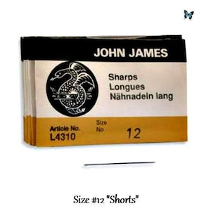 May include: A package of John James brand sewing needles, size 12 "Shorts". The package is black and gold with the brand name and needle type in white. A black and white illustration of a serpent is on the package.