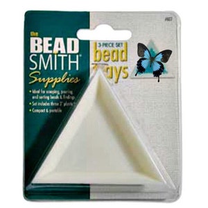 May include: A 3-piece set of white triangular bead trays from The Bead Smith Supplies. The package includes three trays and features a blue butterfly graphic. The packaging is green and white.