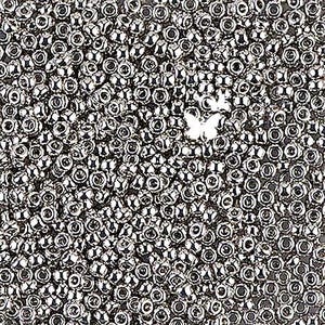 May include: A close-up shot of a pile of small, shiny, silver-colored beads. The beads are round with a hole through the center. A small, white butterfly-shaped charm is visible among the beads. The beads are likely used for jewelry making or crafting.