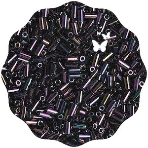 May include: A large quantity of iridescent black glass beads in a tube shape. The beads are scattered in a pile.