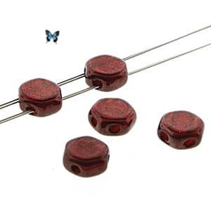 May include: Five dark red hexagonal glass beads with a hole in the center. The beads are strung on two silver wires.