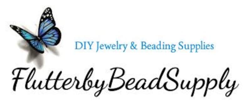 May include: A logo for Flutterby Bead Supply, featuring a blue and black butterfly with a white background. The text "DIY Jewelry & Beading Supplies" is in teal, and the company name is in elegant black script.