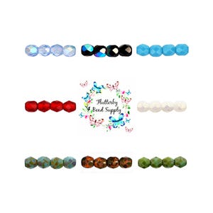 May include: An assortment of faceted beads in various colors, including light blue, iridescent black, turquoise, red, white, teal, brown, and green. The beads are arranged in rows, showcasing their different hues and textures. The image also includes the text "Flutterby Bead Supply".