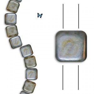 May include: A path of small, square, iridescent tiles in shades of gray and white, with a single blue butterfly flying above. A single, larger, square tile in the same color scheme is centered in the image.