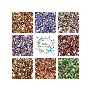 May include: Nine square displays of faceted beads in various colors, including gold, purple, blue, and green. The center square features a floral design with butterflies and the text "Flutterby Bead Supply."