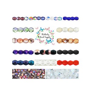 May include: Rows of faceted beads in various colors, including purple, green, and clear, are displayed. The image also features a logo with the text "Flutterby Bead Supply" surrounded by butterflies.