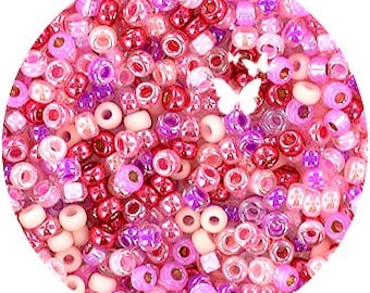 May include: A mix of pink, red, and white seed beads in various sizes and shapes.