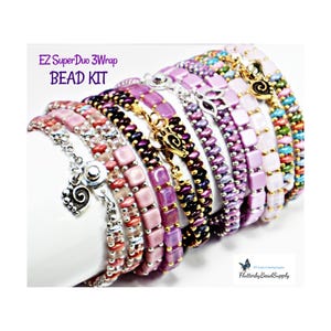 May include: A collection of beaded bracelets in various colors, including pink, purple, and teal. The bracelets feature different bead designs and charms. Text on the image reads "EZ SuperDuo 3Wrap BEAD KIT".