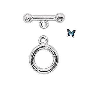 May include: Silver toggle clasp with a round ring and two ball ends. The clasp is a popular jewelry making component.